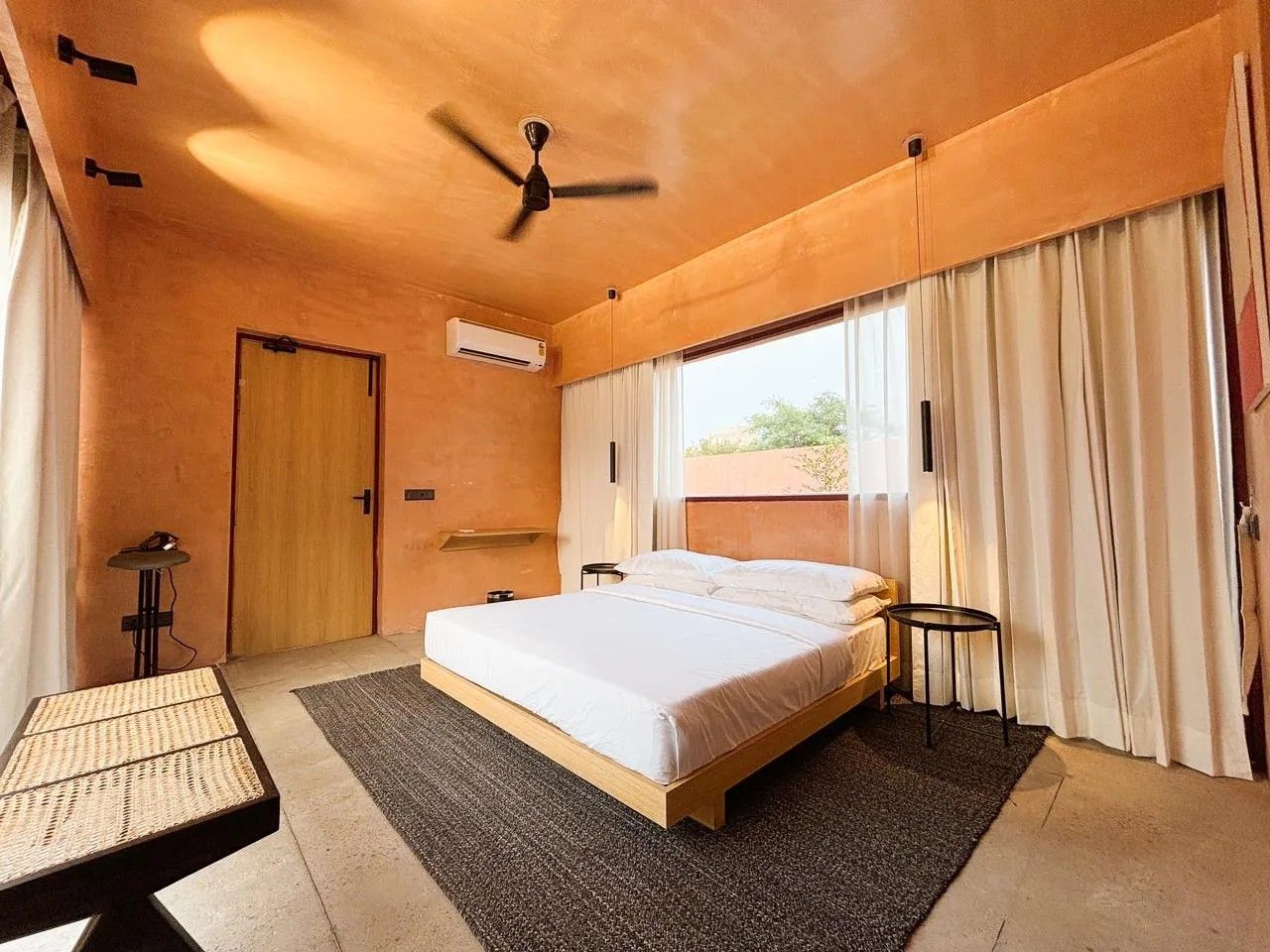 Apricot Garden Courtyard bedroom with a wide window and linen curtains