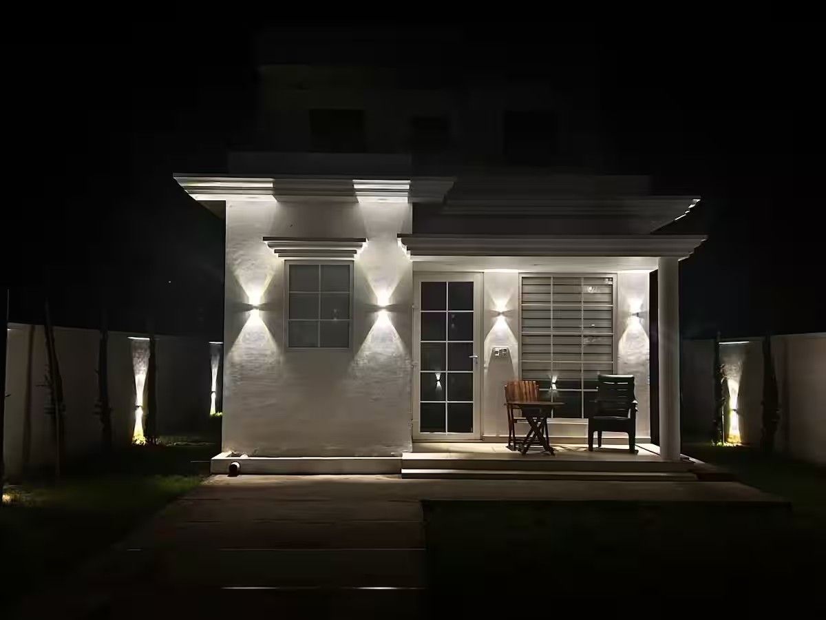 Apricot Garden Cottage exterior lit at night