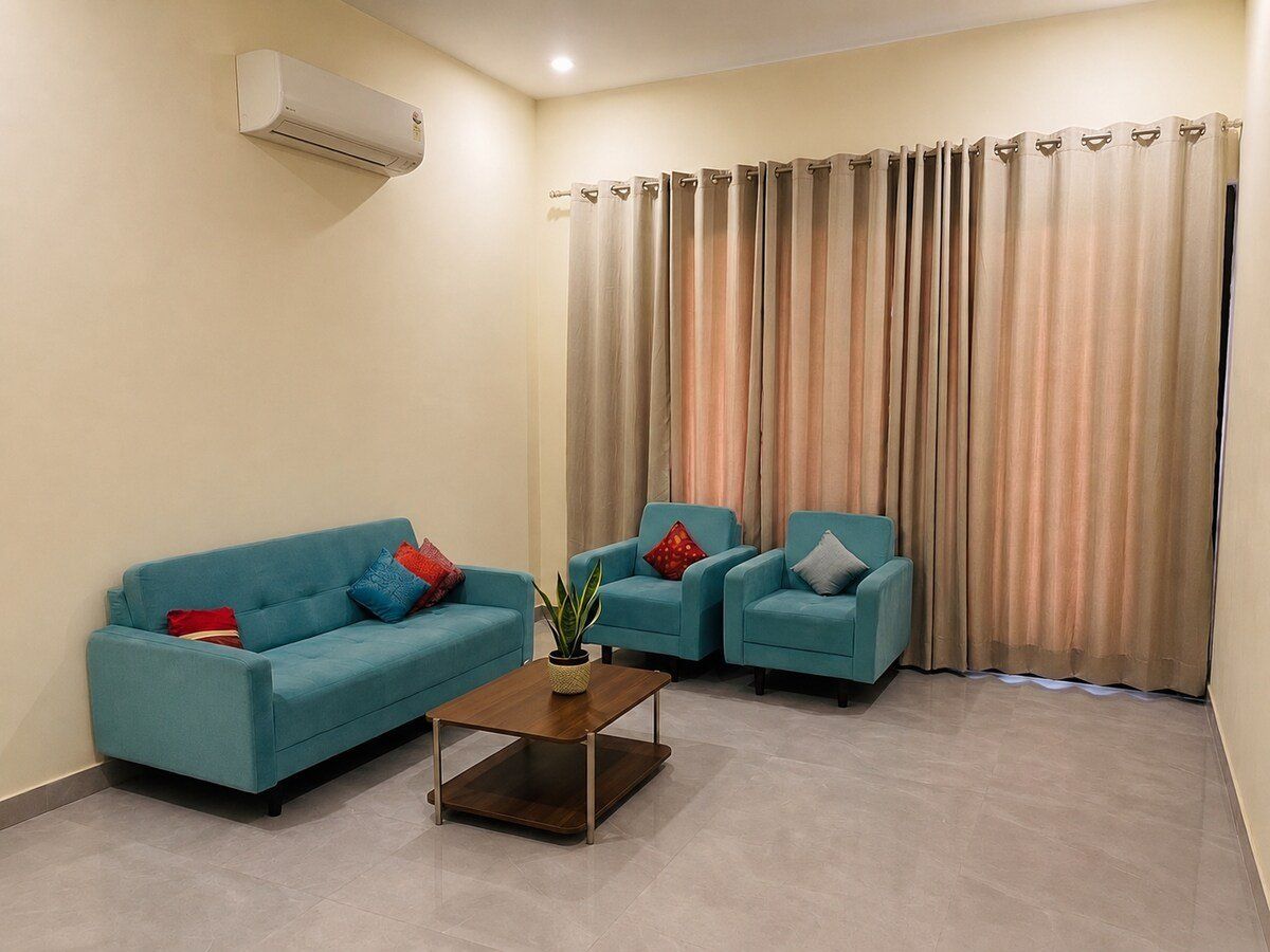 Living room seating with full-length curtains